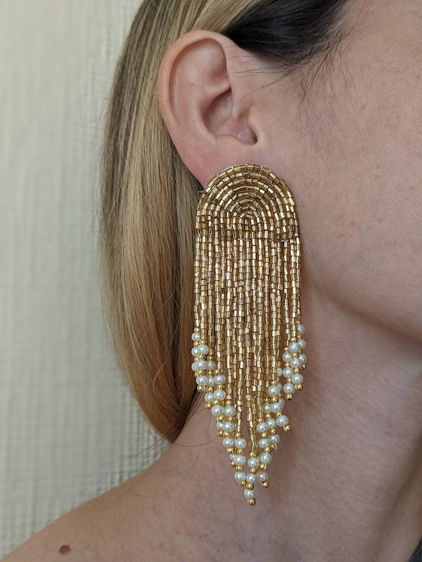 earrings with gold beads and pearl white crystals.