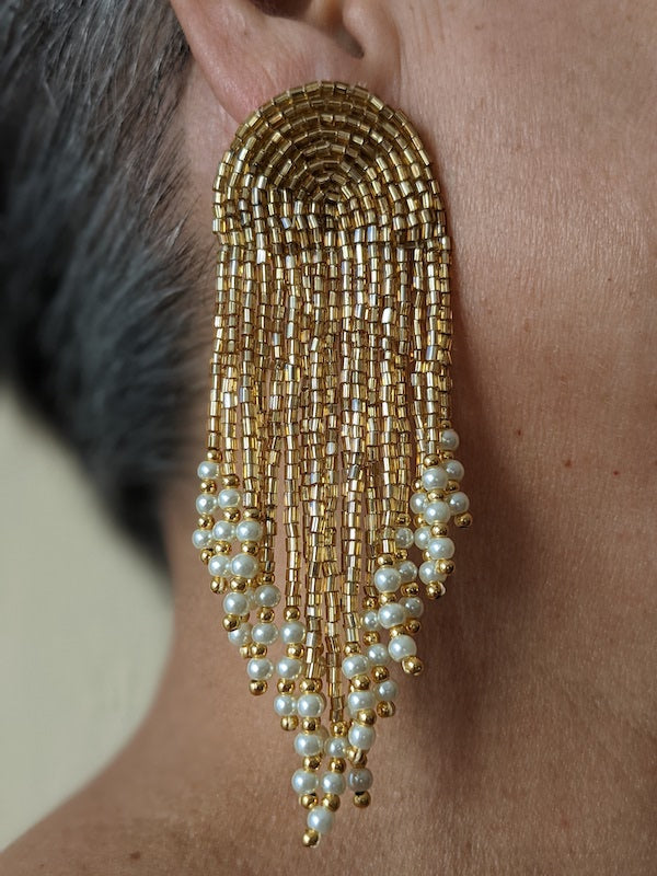 earrings with gold beads and pearl white crystals.