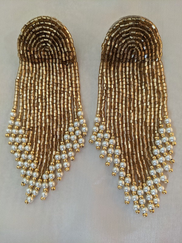 earrings with gold beads and pearl white crystals.